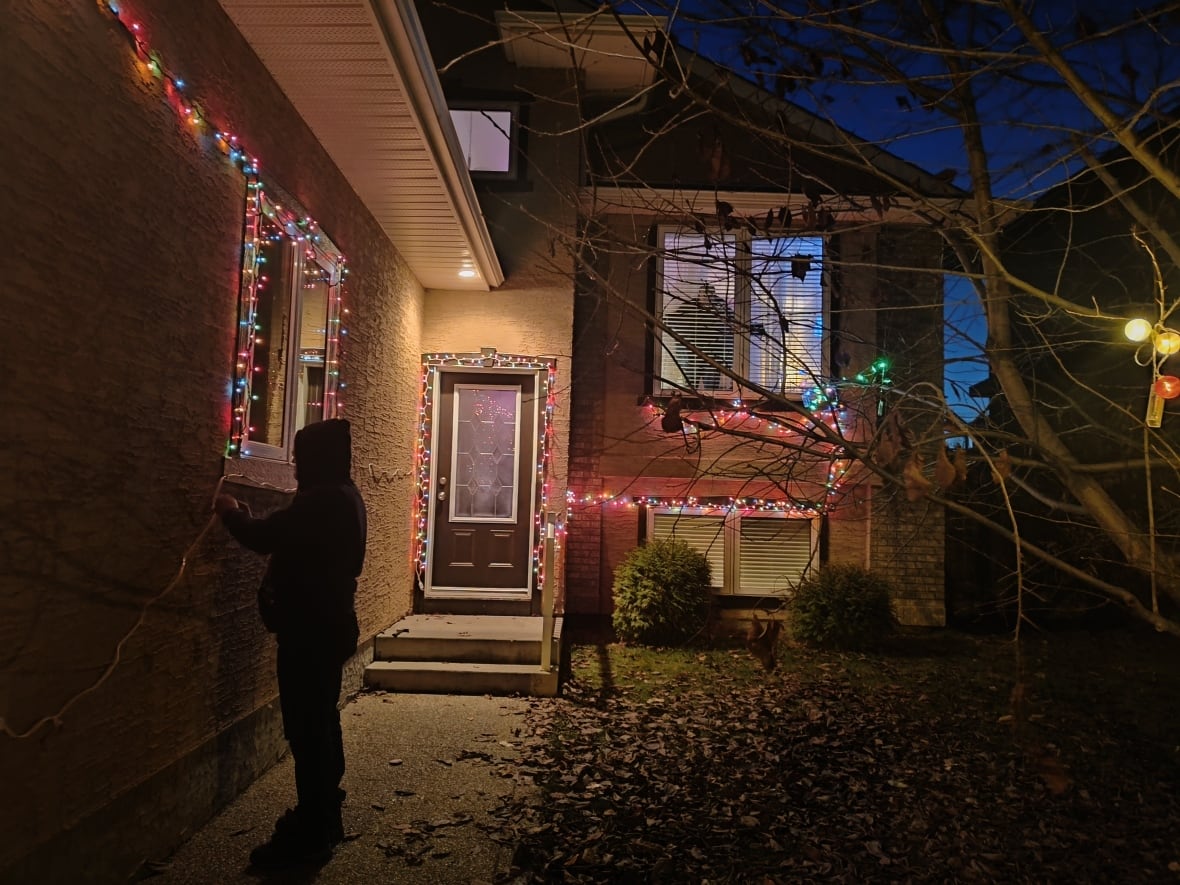 Christmas lights illuminate Datta's new residence in Saskatoon.