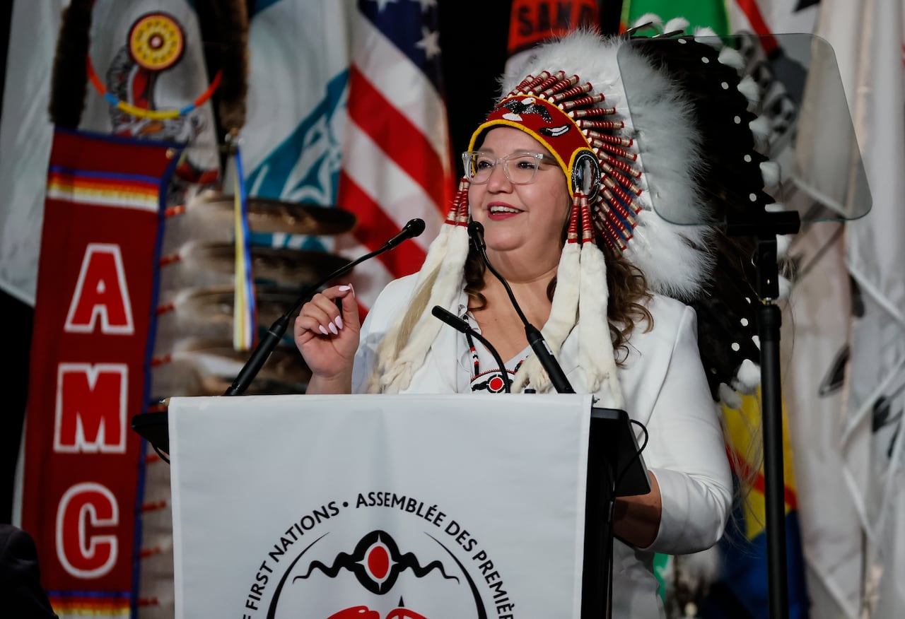 Woman speaking at a podium.