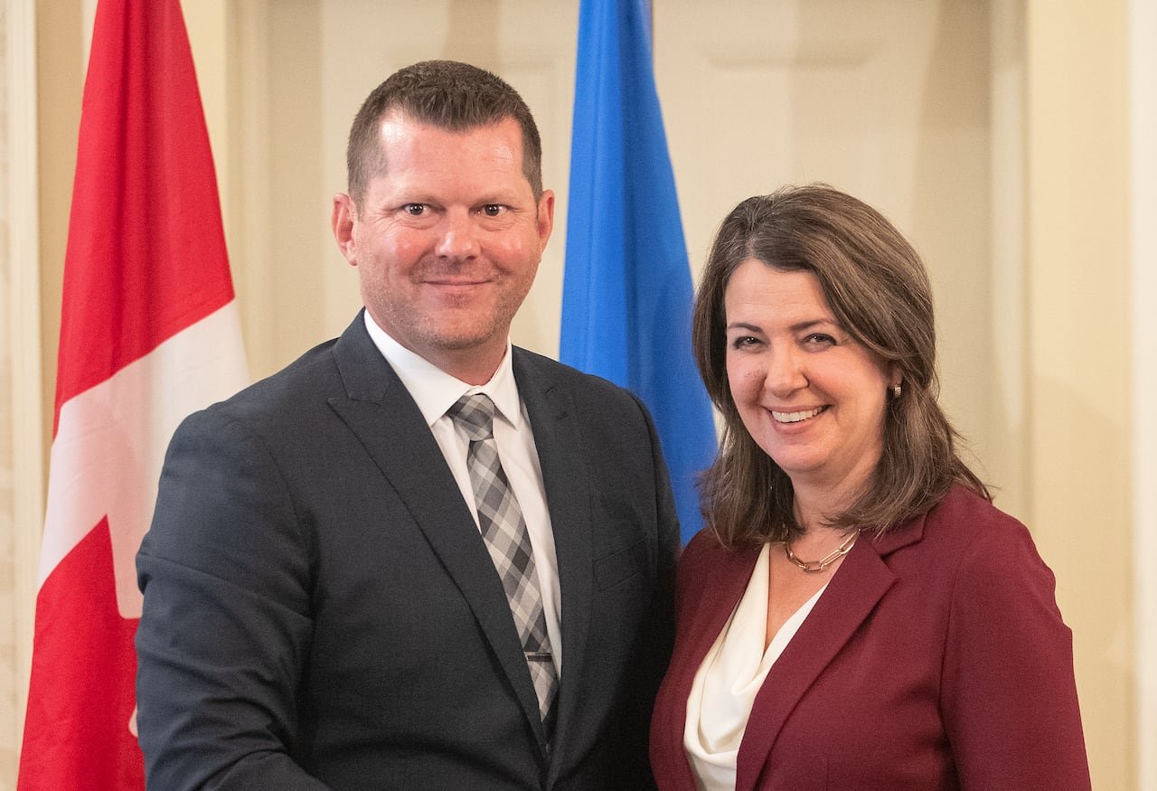 default-122 Alberta Premier Danielle Smith and Agriculture and Irrigation Minister RJ Sigurdson stand together during the swearing in of her cabinet, in Edmonton, Friday, June 9, 2023. THE CANADIAN PRESS/Jason Franson.